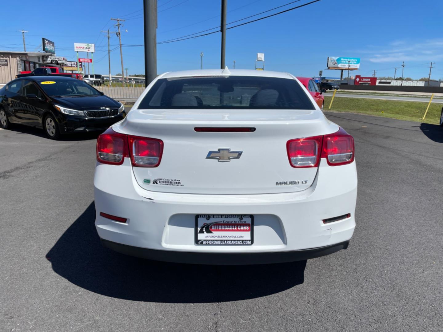 2014 White Chevrolet Malibu (1G11E5SL9EF) with an 4-Cyl, 2.5 Liter engine, Automatic, 6-Spd w/Overdrive and Manual Mode transmission, located at 8008 Warden Rd, Sherwood, AR, 72120, (501) 801-6100, 34.830078, -92.186684 - Photo#6